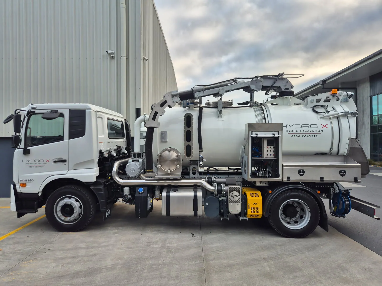 Small hydro excavation truck, side profile, boom stowed
